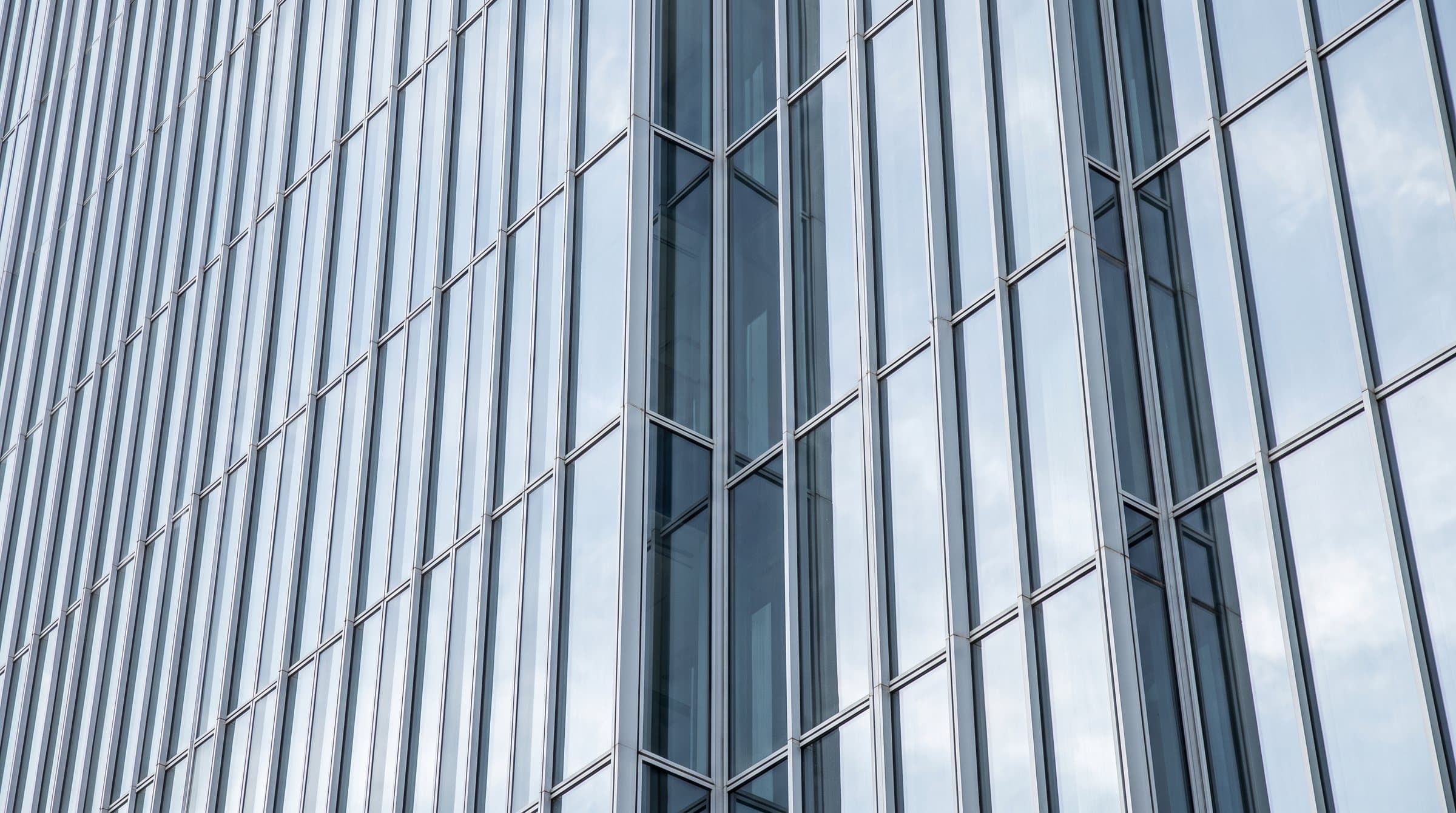 Glass curtain wall reflecting the sky