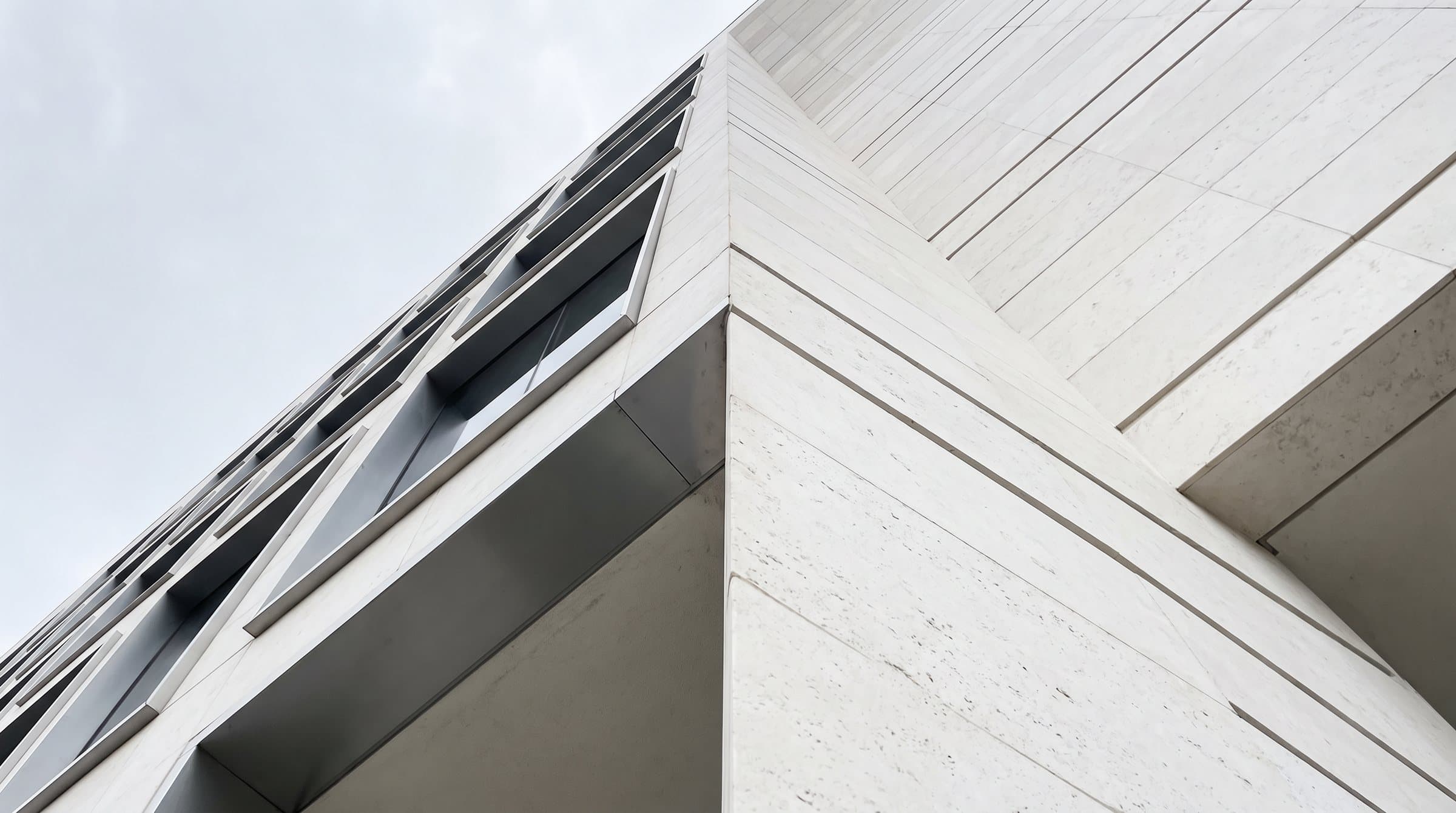 White stone building seen from below